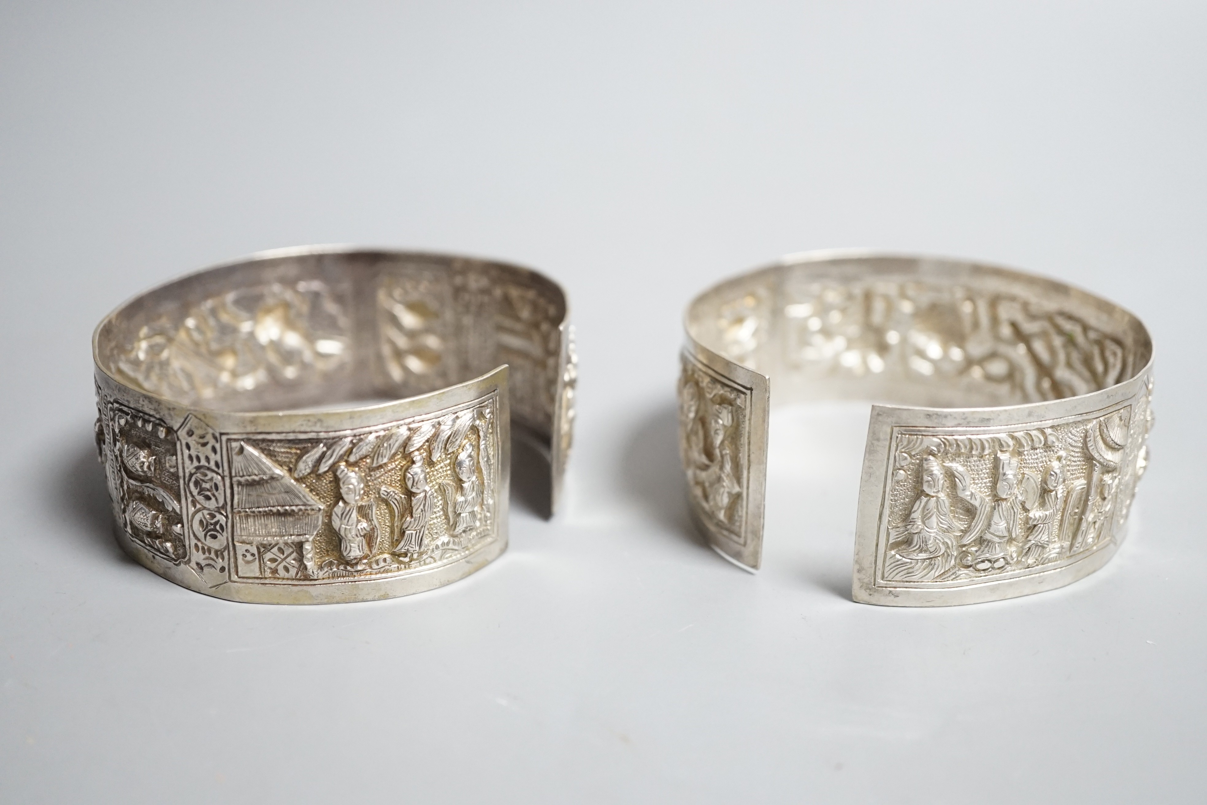 A pair of early 20th century Chinese white metal bangles